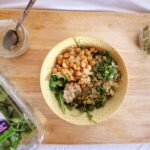 vegan caesar grain bowl overhead with vegan caesar dressing and arugula