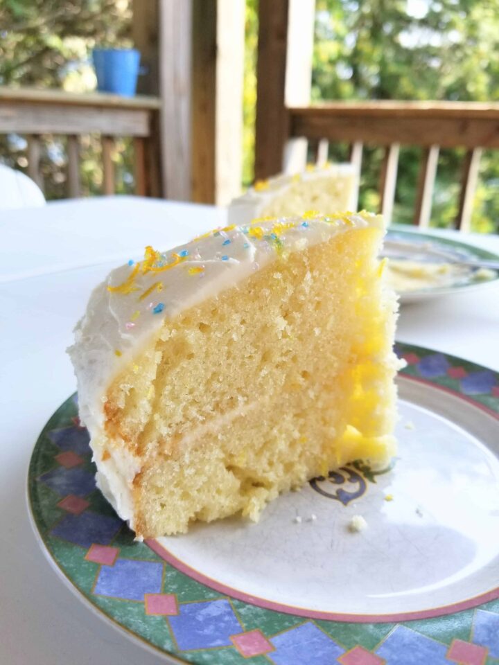 One slice of lemon cake on a porch