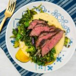 Cheesy Polenta with Grilled Steak and Garlicky Greens | Sip + Spice