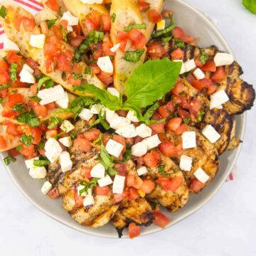 Platter of Grilled Chicken with Bruschetta and mozzarella