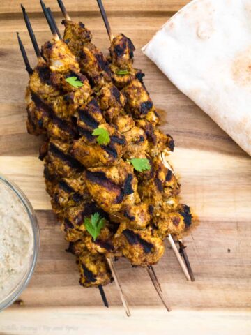 Spice up your life with these Yogurt-Marinated Chicken Shawarma Kebabs. They seem to use every spice in the cabinet, but they're 100% worth it. Prep 'em in the AM and let that chicken marinate! Grill in the evening for yourself or a big group of friends. A total crow pleaser! | Sip and Spice #yogurtmarinatedchicken #chicken #notboringchicken #kebabs #grill #grillingrecipes #spicedchicken #shawarma
