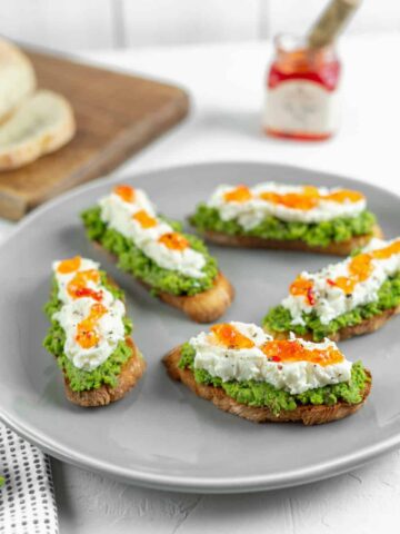 Pea Pesto Crostini with Ricotta and Red Pepper Jelly | Sip and Spice