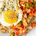Savory Oatmeal with a Fried Egg and Bacon | Sip and Spice