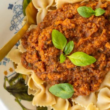 Final Image Veggie Bolognese with Fresh Basil on Chickpea Pasta